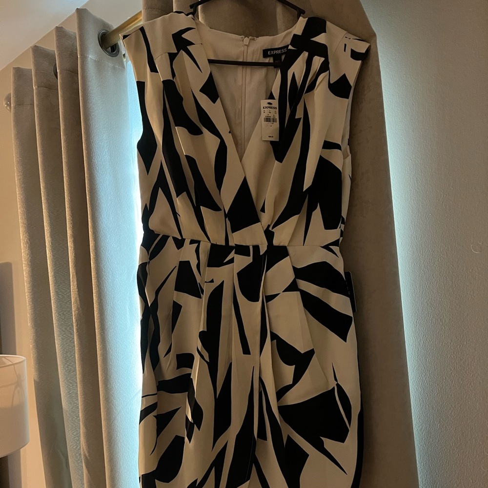 Woman’s black and white cocktail dress